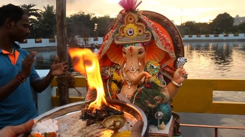 Devotees perform puja Stock Footage 95011997