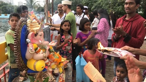 Devotees perform puja Stock Footage 95071597