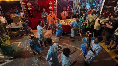 Devotees perform a vibrant stick dance during the Thaipusam festival. Stock Footage 318088147