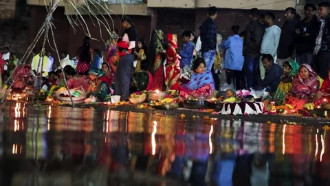 Devotees Performing Chhath Puja Worship Along Sacred Riverbank Stock Footage 340890296