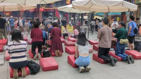 Devotees praying with moon blocks at Wong Tai Sin Temple Hong Kong Stock Footage 271190695