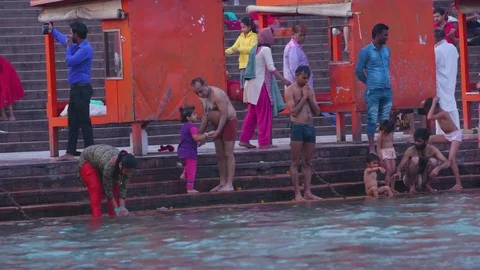 Devotees praying near Ganga Stock Footage 77483688