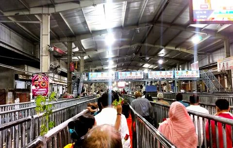 Devotees standing in queue with roses inside Khatu Shyam temple Stock Photos