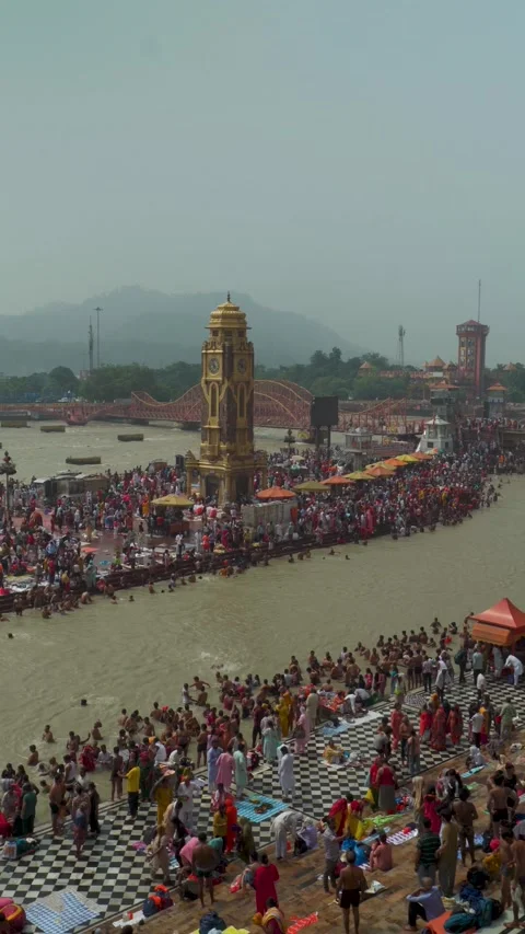 Devotees Taking Holy Dip in Ganges at Har Ki Pauri on Sawan Shivratri, Haridw Stock Footage 330230532