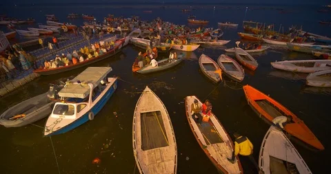 Devotees waiting in small boats on Ganges river banks for aarti prayers, India Stock Footage 113721304