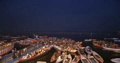 Devotees waiting in small boats on Ganges river banks for aarti prayers, India Stock Footage 113721427