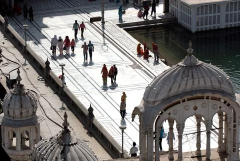 Devotees walking on marble pattern flooring in Sri Harimandir Darbar Sahib .. Stock Photos