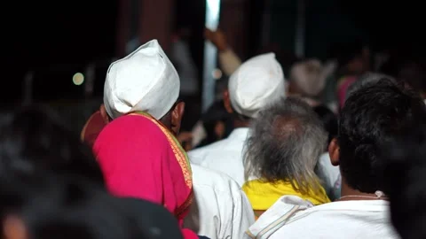 Devotees Wearing Traditional Caps at Religious Gathering 库存影片 334235748