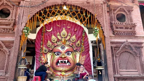 Devotees Worship Offer Flower And Food To The Mask Of Swet Bhairav During Video stock 130627038