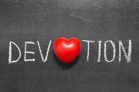 Devotion devotion word handwritten on chalkboard with heart symbol instead... Stock Photos