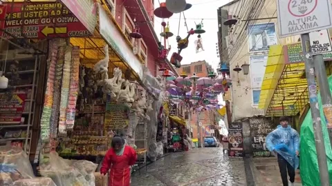Devotion to saints, Andean rituals and Chinese symbols to welcome New Year in Bo Stock-Footage 260073356
