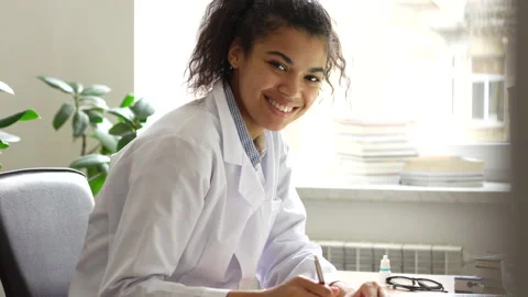 Devotion to studying. Enthusiastic happy young female medical student making Stock Footage 145791125