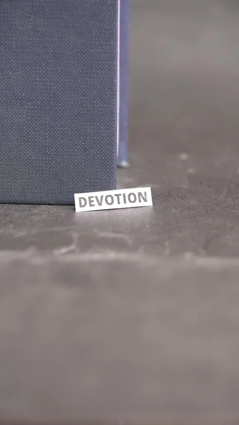 Devotion Word on Paper Label Representing Commitment, Faith and Dedication Stock Footage 338344830