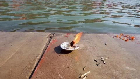 Devotional Diya Flame Symbolizing Prayer And Blessings At Sacred Ghat Stock Footage 338402552