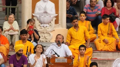 Devotional Singing with Harmonium During Arti at Parmarth Niketan in Rishikesh Stock Footage 236777434