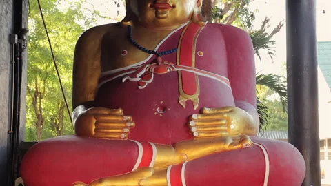 Devotional Thai Buddha Statue in a Traditional Gold-Adorned Temple Stock-Footage 333706247