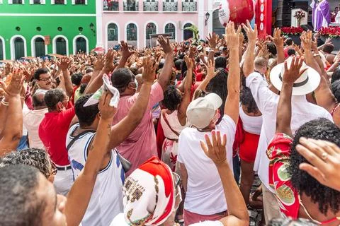 Devout Catholics of Santa Barbara raise their arms to the sky in Stock Photos