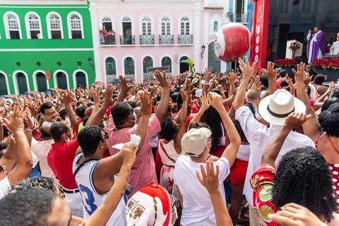 Devout Catholics of Santa Barbara raise their arms to the sky in Stock Photos