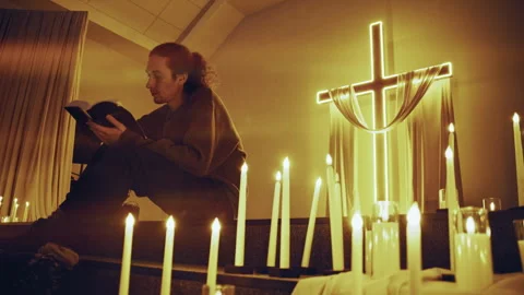 Devout christian man reading bible by candlelight Stock-Footage 327207512