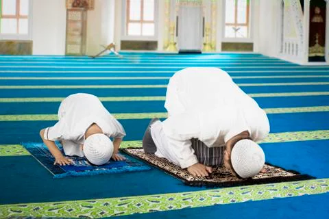 Devout family is prostration in the mosque Stock Photos