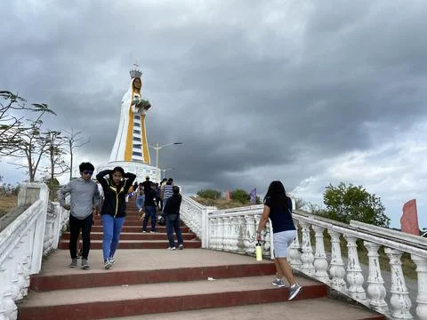 Devout people perform pilgrimage to the sculptured image of Mary Stock Photos