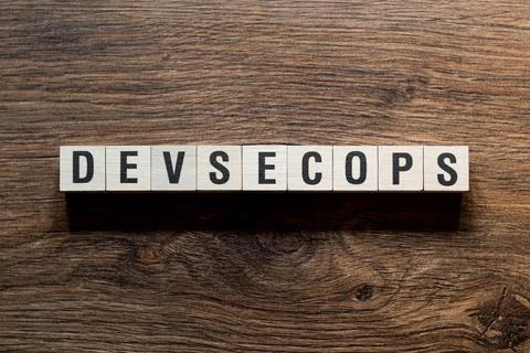 Devsecops - word concept on building blocks, text Stock Photos