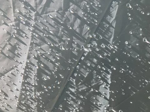 Dew drops with sunshine light all over white tent Stock-Fotos