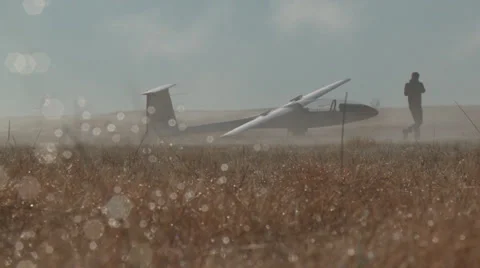 Dew on the grass as a Glider prepares for early morning flight Stock Footage 30512449