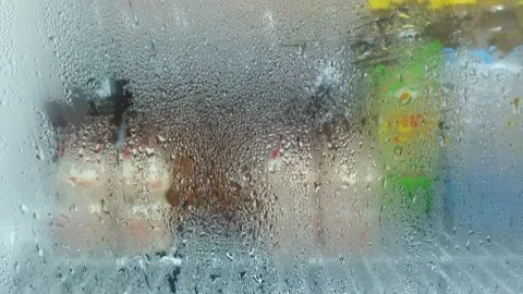 Dew on the transparent door Stock Footage 159576942