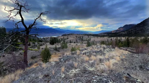 Dewdrop range grasslands, scenic, mountains,  lake under storm clouds, B.C. Stock Footage 257613294
