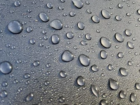 Dewdrops fall on the metal surface Stock Photos