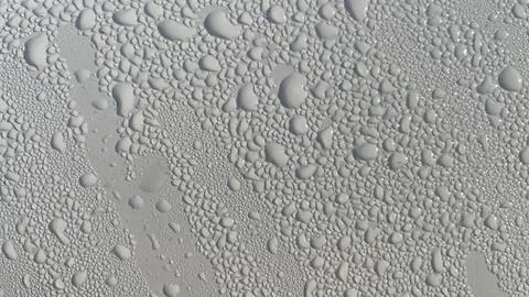 Dewdrops fall on the metal surface Stock Photos