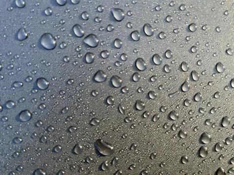 Dewdrops fall on the metal surface Stock Photos