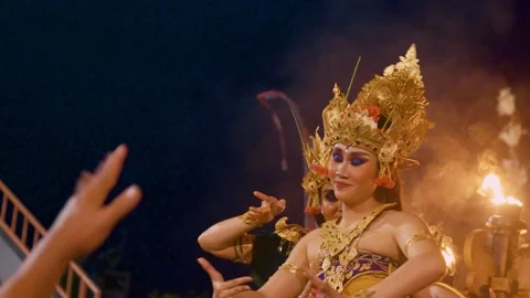 Dewi Sinta performs the Kecak dance in front of male dancers, Bali 動画素材 261800792