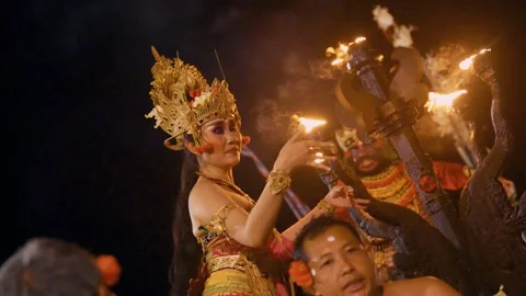 Dewi Sinta performs the Kecak dance in front of male dancers, Bali Video stock 261804013