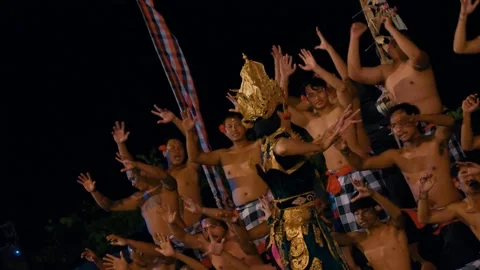Dewi Sinta performs the Kecak dance in front of male dancers, Bali 動画素材 261851090