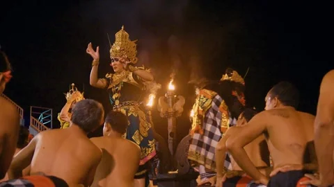Dewi Sinta performs the Kecak dance in front of male dancers, Bali Video stock 261858658