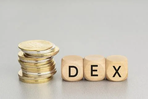 DEX or decentralized crypto exchange concept. Stacked crypto coins and wooden Foto stock