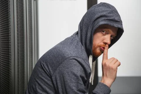 Dexterous male hacker focusing on code Stock Photos
