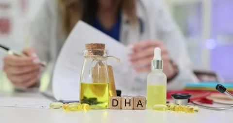 DHA cubes placed by omega-3 oil bottle and dietary supplements Stock Footage 314117982