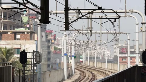 Dhaka Metro Rail Entering Elevated Station in Dhaka City Stock Footage 313582030