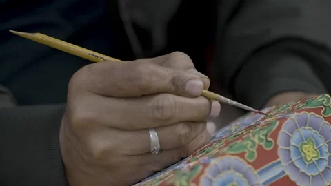 DHARAMSHALA, INDIA - 2025, OCT 18: Artisan Hand Painting Tibetan Motif Stock Footage 345633055
