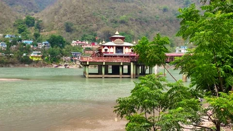 Dhari Devi Temple On River Pillars Framed By Green Foliage Stock Footage 341271969