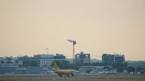 DHL Boeing 757 cargo aircraft taxiing at Toulouse airport at sunset Stock Footage 336462530