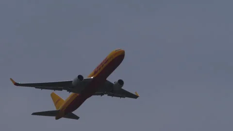 DHL cargo plane flies overhead Stock Footage 296813339