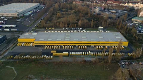 DHL Deutsche Post logistics center berlin city. Magic aerial view drone Stock Footage 322704037