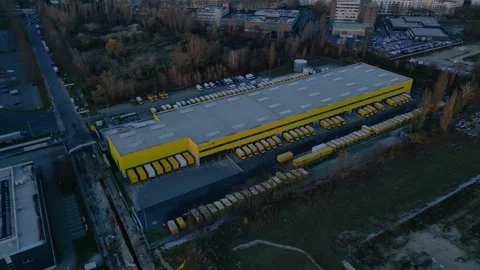 DHL Deutsche Post logistics center berlin city. Dramatic aerial view drone Stock Footage 322704239