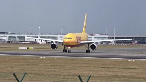DHL Heavy Cargo Airplane Lining up onto the Runway for Takeoff Stock Footage 250077976