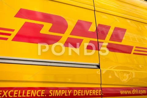 DHL logistic company sign on the delivery van at day time Stock Photos