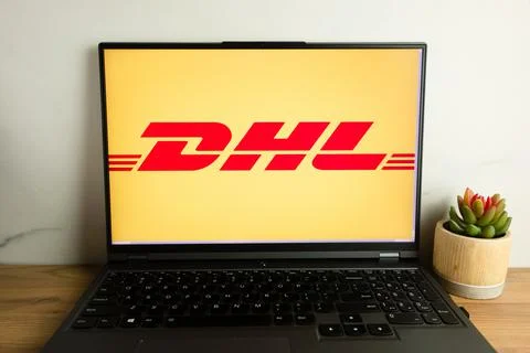 DHL logistics company logo displayed on laptop Stock Photos